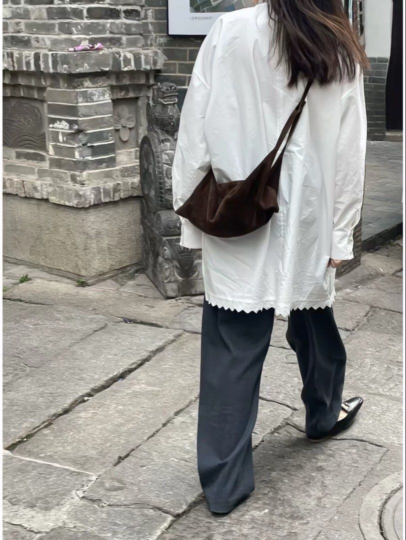 White Asymmetric Lace Panel Long Sleeve Blouse (Category: Longsleeves) located in Taguig. Submitted by mengxir20193848 (Listing ID 1466679406, Image 3). Description: - Color: White - Fit: Loose oversized fit, great for casual wear - Material: Lightweight and comfortable cotton - Design: Asymmetric layered style with eyelet embroidery lace panels - Details: Chic scallop hemline and round neckline (pullover style).