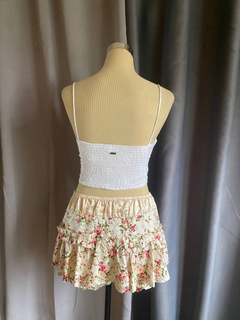 Ghanda White Eyelet Corset Cami Top (Category: Sleeveless) located in Cagayan de Oro. Submitted by curated_closetph (Listing ID 1469347903, Image 3). Description: — Size: XS - S — Color: White — Broderie anglaise eyelet fabric — Sweetheart neck with front tie detail — Button-down front accents — Pointed asymmetrical hem — Smocked ruched stretch back — Can negotiate the price — 🛒 Shop more to get more discounts and freebies!.