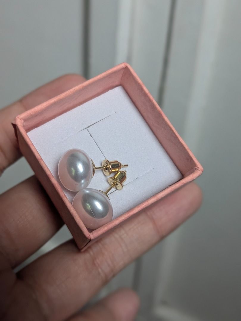 White Faux Pearl Earrings (Category: Earrings) located in Quezon City. Submitted by nnncorner (Listing ID 1469323637, Image 2). Description: Pearl White Faux Pearl Earrings Hypoallergenic Not so lightweight With box 480.