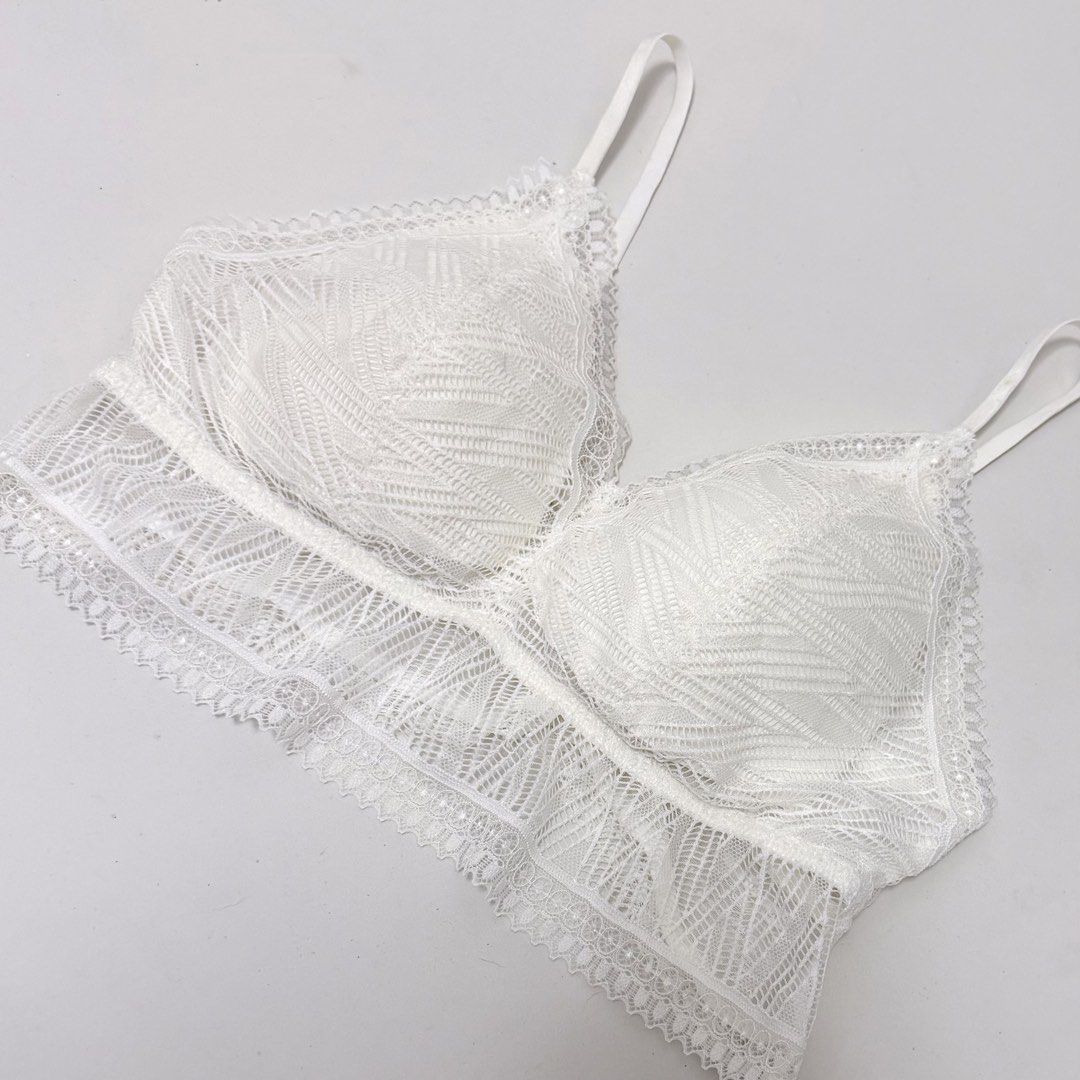 White Lace Triangle Bralette [L/XL] (Category: Undergarments & Loungewear) located in Malabon City. Submitted by k_intimates (Listing ID 1469200553, Image 2). Description: Details: • Size L/XL / wireless / padded • Like new—unused condition • White lace bralette with a longline scalloped hem and thin adjustable shoulder straps..