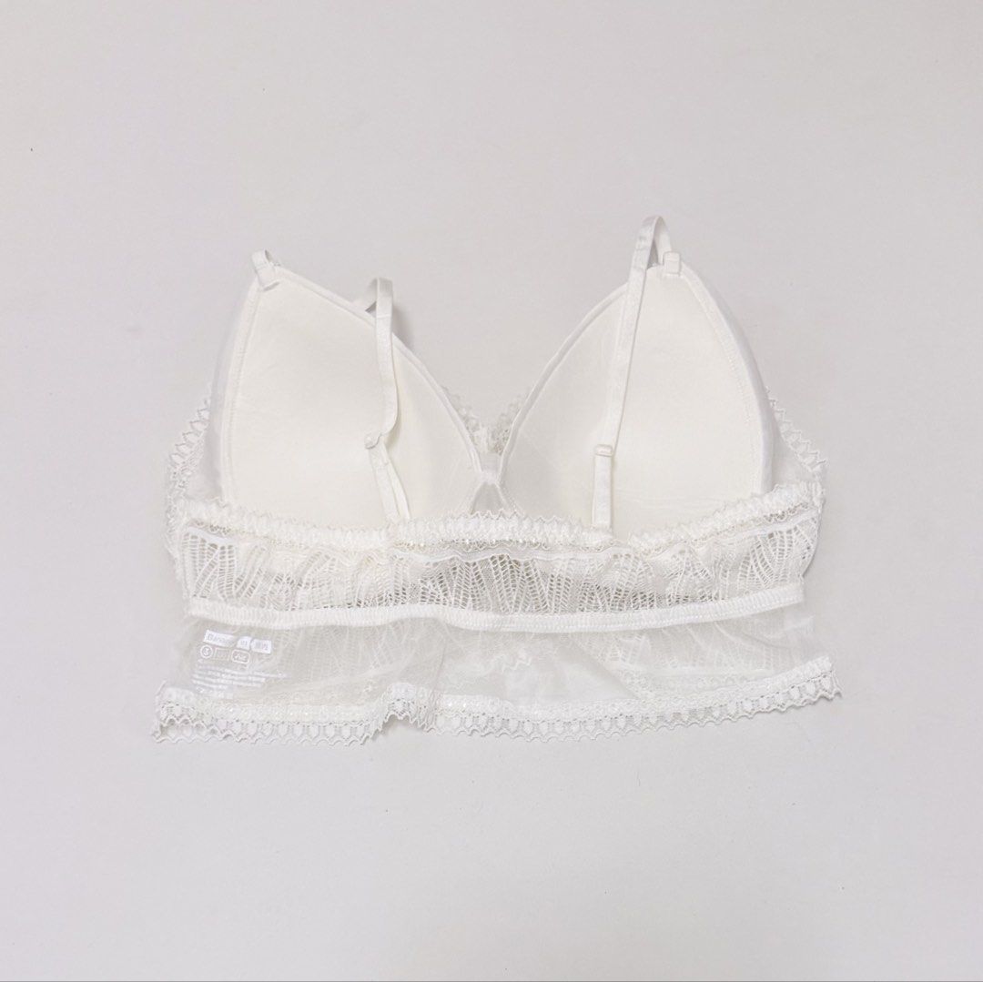 White Lace Triangle Bralette [L/XL] (Category: Undergarments & Loungewear) located in Malabon City. Submitted by k_intimates (Listing ID 1469200553, Image 3). Description: Details: • Size L/XL / wireless / padded • Like new—unused condition • White lace bralette with a longline scalloped hem and thin adjustable shoulder straps..