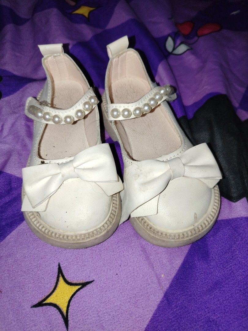 White pearl ruffle girls boots (Category: Babies & Kids Fashion) located in Manila. Submitted by nesacake (Listing ID 1469295906, Image 3). Description: - Style: White ankle boots with cute side bow, pearl trim, and sheer ruffles - Sole & Closure: Chunky brown sole with convenient side zipper for easy wear - Condition: Clean overall with minor scuffs on the toe area - Perfect for adding a sweet, feminine touch to your outfit!.