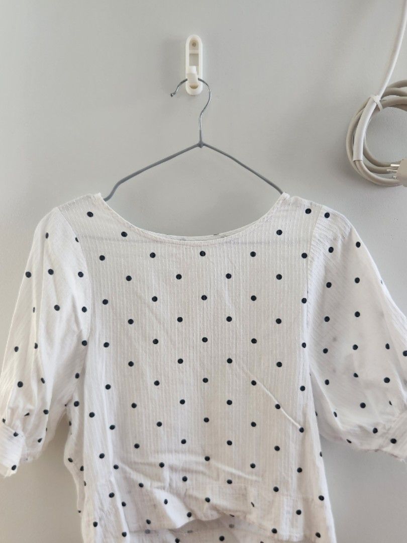 White Polka Dot Puff Sleeve Blouse (Category: Blouses) located in Binan City. Submitted by prettyfishcakeee (Listing ID 1469311822, Image 1). Description: - Color & Pattern: White with small black polka dots - Neckline: Classic crew neck - Sleeves: 3/4 length puff sleeves - Fabric: Lightweight and slightly textured - Fit: Waist-length - Styling: Perfect to pair with jeans or skirts for casual days out.