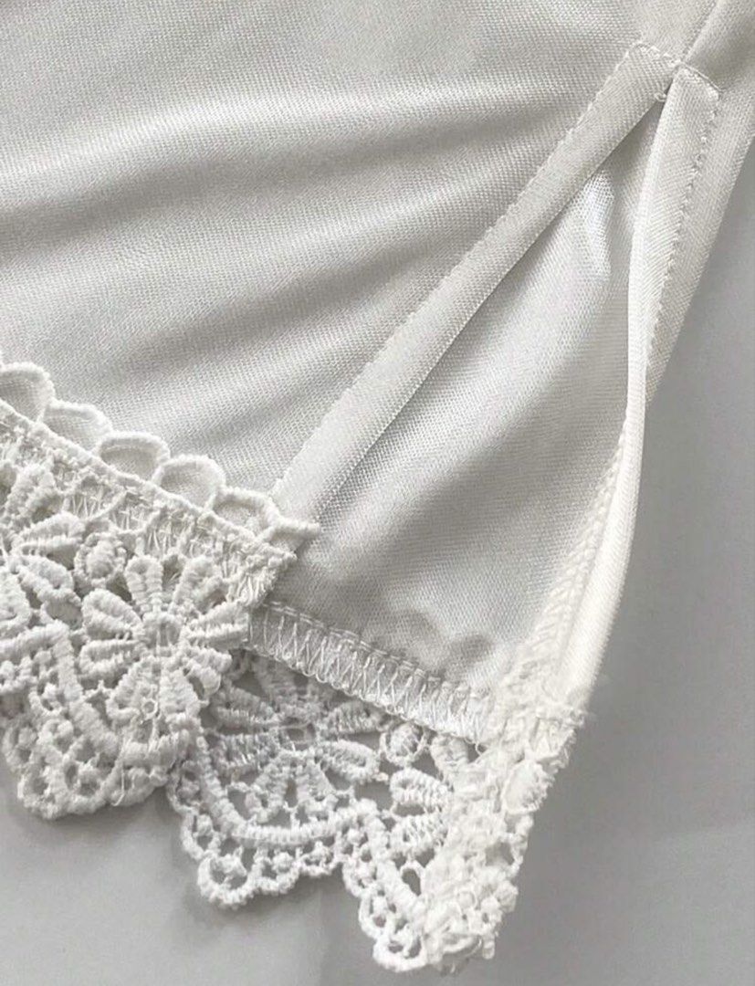 White Satin Lace Half Slip Skirt Extender (Category: Skirts) located in Cagayan de Oro. Submitted by redbluerider (Listing ID 1469167953, Image 2). Description: - Color: Classic White - Material: Smooth, silky satin - Fit: Stretchy elastic waistband for comfort - Design: Delicate floral lace trim and convenient side slit for easy movement - Purpose: Provides smooth coverage under skirts and dresses.