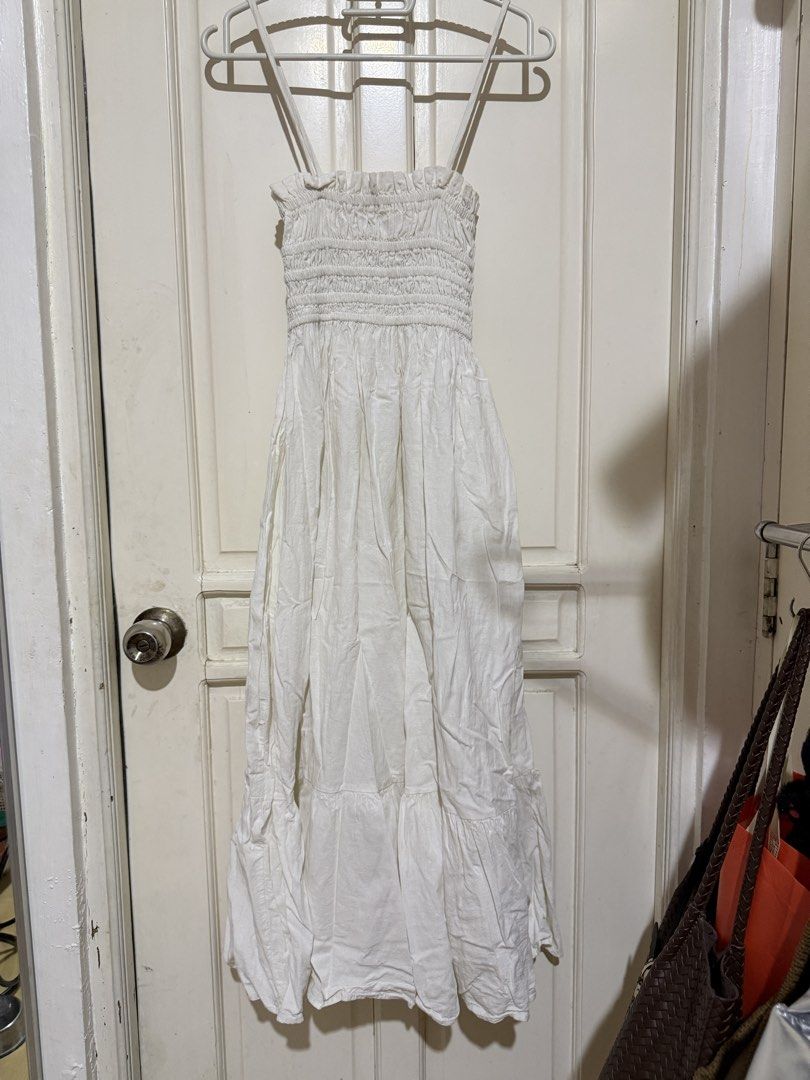 White smocked maxi dress (Category: Dresses) located in Marikina City. Submitted by louvy.r (Listing ID 1469314784, Image 1). Description: Length - 38 inches.