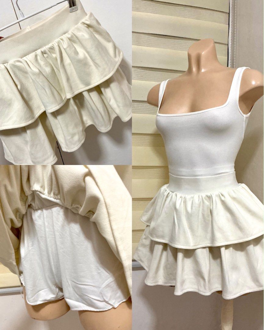 White tiered ruffle skort with built-in shorts (Category: Skirts) located in Cavite. Submitted by jcai03 (Listing ID 1469309122, Image 1). Description: - Color: Clean cream-white - Design: Double-layer tiered ruffles with great volume - Comfort: Easy slip-on elastic waistband - Feature: Built-in shorts underneath for worry-free wear - Styling: Pairs perfectly with basic tanks or tees.