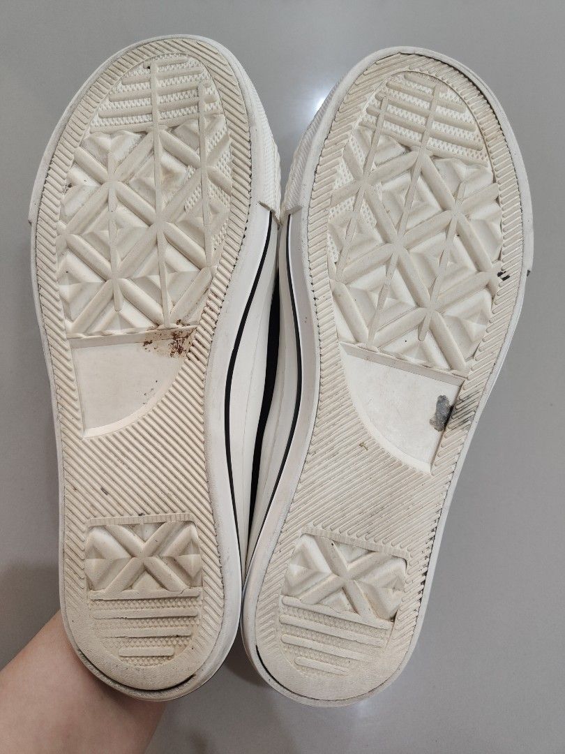 Whovoc Black and White Canvas Sneakers (Category: Sneakers) located in Calamba. Submitted by an_ne0501 (Listing ID 1469214865, Image 2). Description: - Color: Classic black with white soles and laces - Design: Low-top canvas sneakers with durable toe caps and metal eyelets - Condition: Good, minor dirt on soles from light outdoor use - Comfort: Highly comfortable and versatile for everyday casual wear - Size: Standard fit (message for exact measu