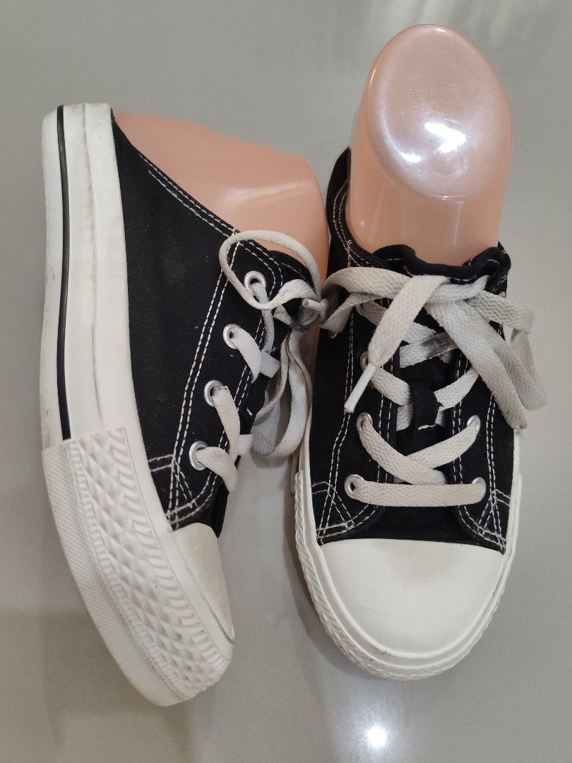 Whovoc Black and White Canvas Sneakers (Category: Sneakers) located in Calamba. Submitted by an_ne0501 (Listing ID 1469214865, Image 1). Description: - Color: Classic black with white soles and laces - Design: Low-top canvas sneakers with durable toe caps and metal eyelets - Condition: Good, minor dirt on soles from light outdoor use - Comfort: Highly comfortable and versatile for everyday casual wear - Size: Standard fit (message for exact measu