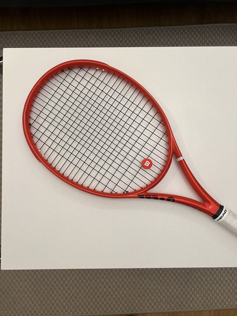 Wilson Defyer Redline Tennis Racket 100UL (Category: Racket and Ball Sports) located in Makati City. Submitted by glette153 (Listing ID 1469323682, Image 3). Description: Wilson Defyer Redline 100 UL V1 Bought at Wilson Shang last September for ₱17,495 (unstrung) - Weight: 265 grams (lightweight and easy to swing) - Head Size: 100 - Grip Size: 2 - Strings: Wilson NXT 17 Tennis String (worth ₱1,495) Includes a Wilson vibration dampener RFS: Switch