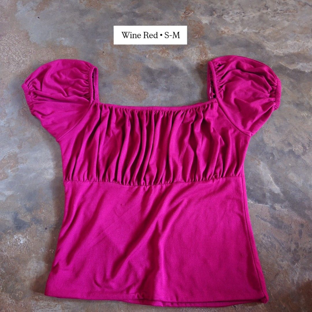 Wine Red Square Neck Ruched Puff Sleeve Top S-M (Category: Blouses) located in Diffun. Submitted by declutteredbyJill (Listing ID 1469236206, Image 1). Description: - Color: Wine red - Size: S-M - Design: Square neckline with ruched chest detailing - Sleeves: Short puff sleeves with elastic cuffs - Fit: Fitted style that hits around the waist - Material: Stretchy and super comfortable for daily wear - Versatility: Easy to pair with both jeans and