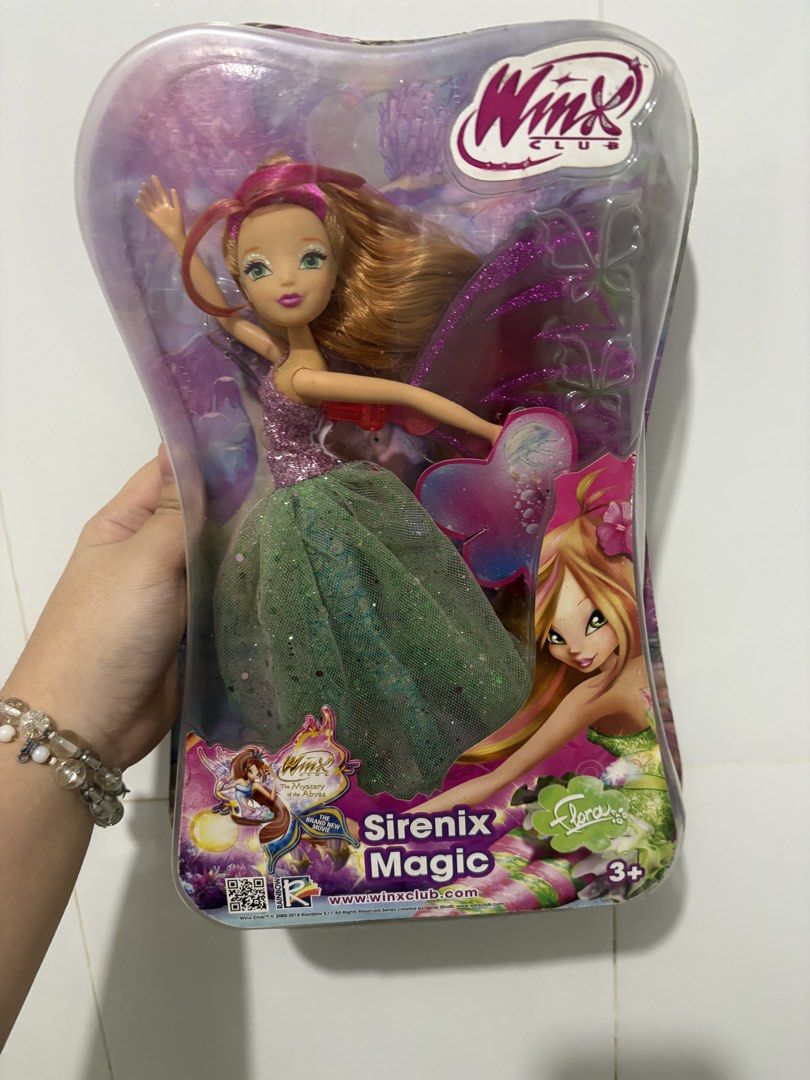 Winx Club BUNDLE (Category: Kids Toys) located in Mabalacat. Submitted by joliexoxo (Listing ID 1469206431, Image 2). Description: - Winx Club Sirenix Magic boxed doll set featuring Bloom and Flora - Dolls come in sparkly dresses with glitter details, translucent wings, and themed accessories - Original packaging with clear plastic covers (minor shelf wear on edges) - Official collectible item, ideal for Winx Club fans and doll collectors - Condi