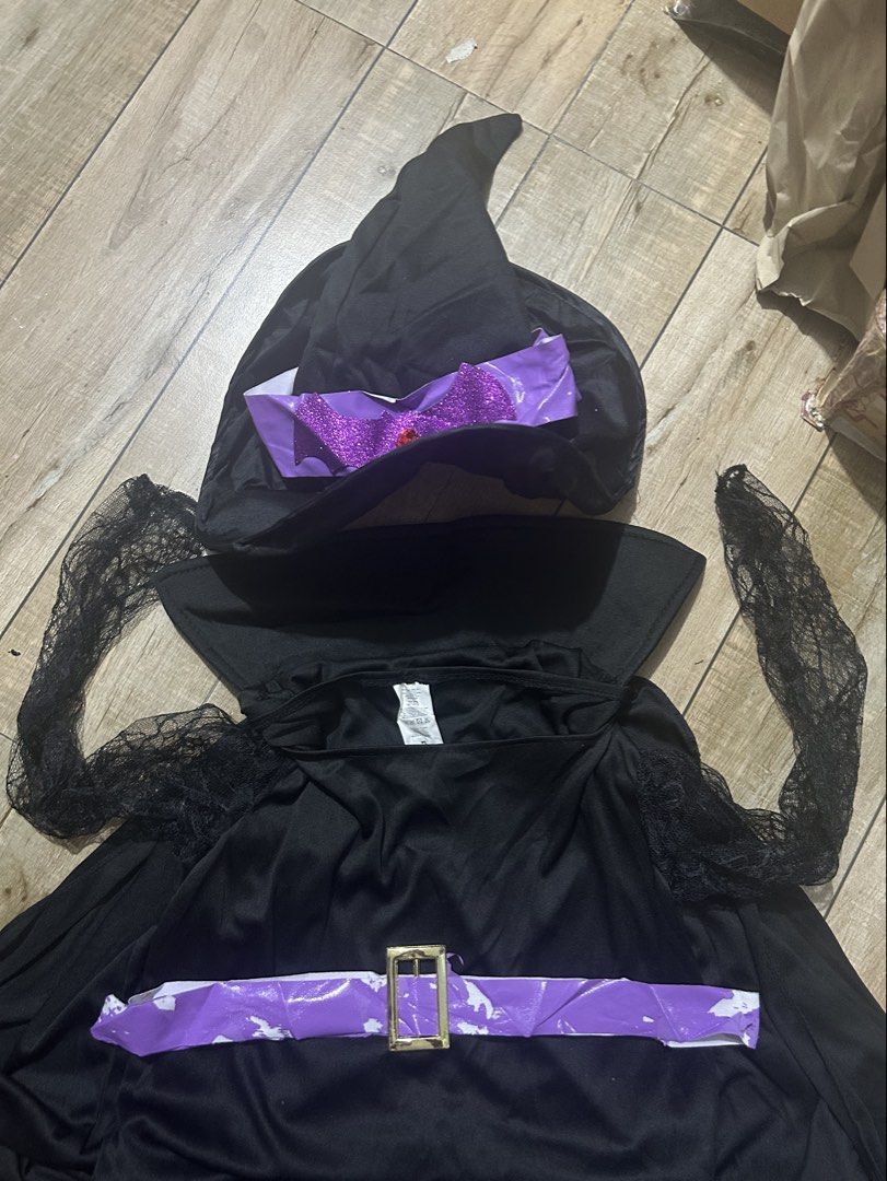 Witch Costume with Hat (Category: Sets or Coordinates) located in Paranaque City. Submitted by zac.sei (Listing ID 1407078352, Image 2). Description: large to XL issues on belt - witch costume! - Includes: Black dress with purple belt, cape, hat with purple accent, gloves with spiderweb design, wig and broom are not included. - Ideal for Halloween or costume parties. - Get ready to cast some spells!.