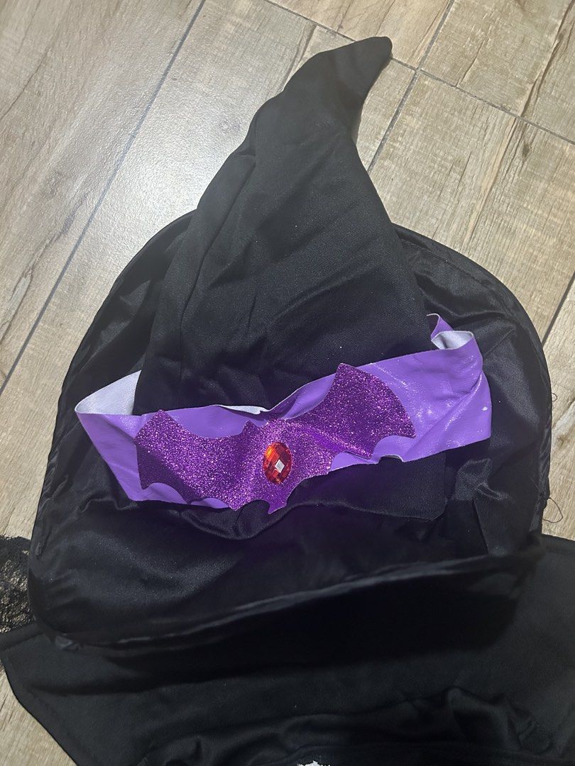 Witch Costume with Hat (Category: Sets or Coordinates) located in Paranaque City. Submitted by zac.sei (Listing ID 1407078352, Image 3). Description: large to XL issues on belt - witch costume! - Includes: Black dress with purple belt, cape, hat with purple accent, gloves with spiderweb design, wig and broom are not included. - Ideal for Halloween or costume parties. - Get ready to cast some spells!.