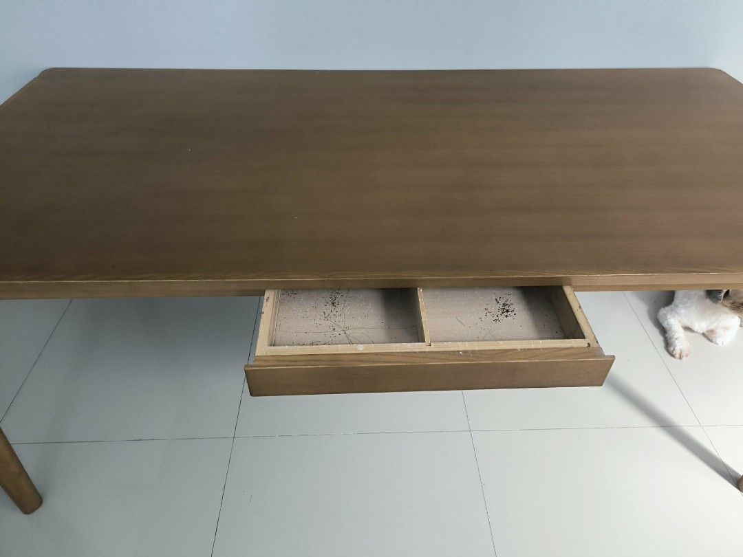 Wooden Study Desk with Single Drawer (Category: Tables & Sets) located in Quezon City. Submitted by mitchellesanguyo (Listing ID 1469241108, Image 1). Description: 6-8 seater dinner table - Classic rectangular wooden desk in a versatile neutral brown finish - Features a smooth, spacious top surface and sturdy legs on both sides - Includes a built-in under-desk drawer for extra storage - Condition note: Interior of the drawer has some stains and m