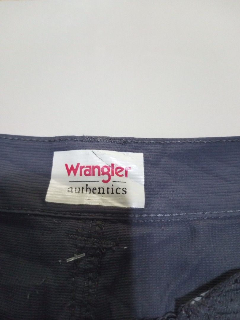 Wrangler Authentics Walk Short Size 46 Dark Grey (Category: Shorts) located in Magdalena. Submitted by magdalenathrift20 (Listing ID 1469168478, Image 3). Description: - Brand: Wrangler Authentics - Item: Walk shorts - Color: Dark grey - Size: 46 (Waist stretches from 46" to 52") - Length: 23" - Material: 100% polyester - Origin: Made in Bangladesh - Features: Zippered side pocket, solid construction - Condition/Use: Great for casual everyday wea