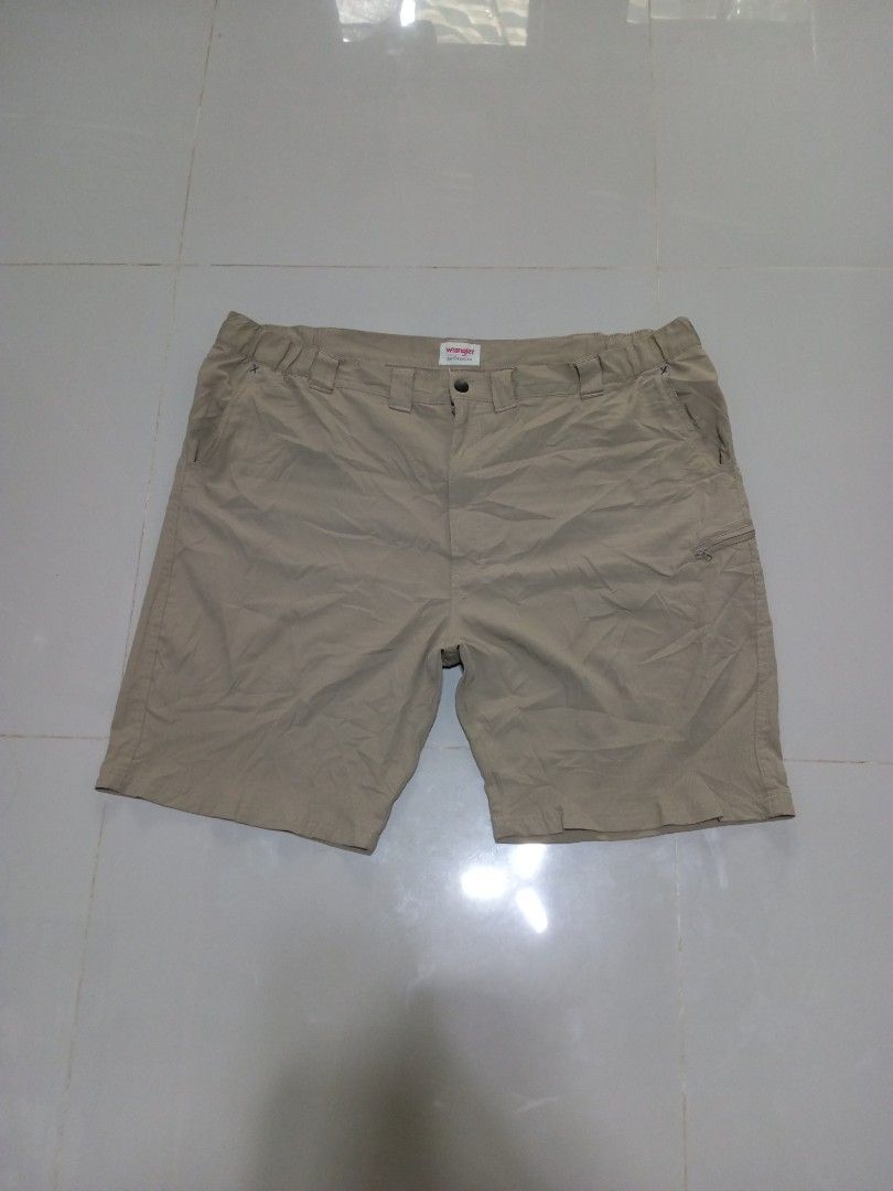 Wrangler Authentics Walk Short Size 46 Khaki (Category: Shorts) located in Magdalena. Submitted by magdalenathrift20 (Listing ID 1469168500, Image 2). Description: - Brand: Wrangler Authentics - Item: Khaki Walk Shorts - Size: 46 (Adjustable waist fits 46 to 52 inches) - Length: 23 inches - Material: 100% Polyester - Features: Secure side zip pocket, button closure, and belt loops - Condition: Clean and well-maintained.