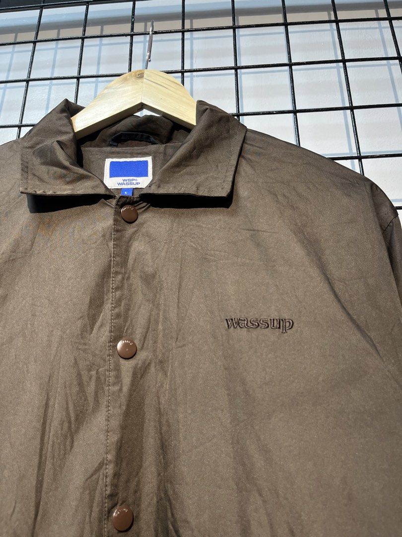 WSP Wassup Brown Coach Jacket Size L (Category: Coats, Jackets and Outerwear) located in Taal. Submitted by thrift_deals23 (Listing ID 1469185172, Image 2). Description: - Brand/Model: WSP Wassup brown coach jacket - Size: L - Details: Snap-button front closure, embroidered chest logo, regular collar, dark inner lining, and adjustable hem drawstrings with toggles - Condition: Clean piece, worn just a few times - Style: Great outer layer for daily