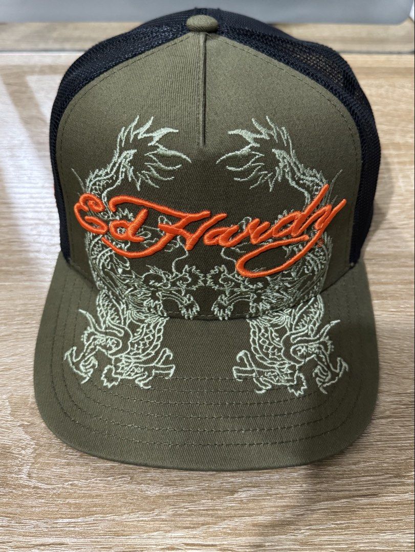 WTT Ed Hardy Dragon Trucker Snapback Cap (Category: Caps & Hats) located in Baguio. Submitted by luvforsim (Listing ID 1469170997, Image 1). Description: • Strictly for trading only! • Bought this at a flea market • Have: Olive and orange colorway • Want: Pink and black colorway (in the picture) - please dm me if u have it !! .