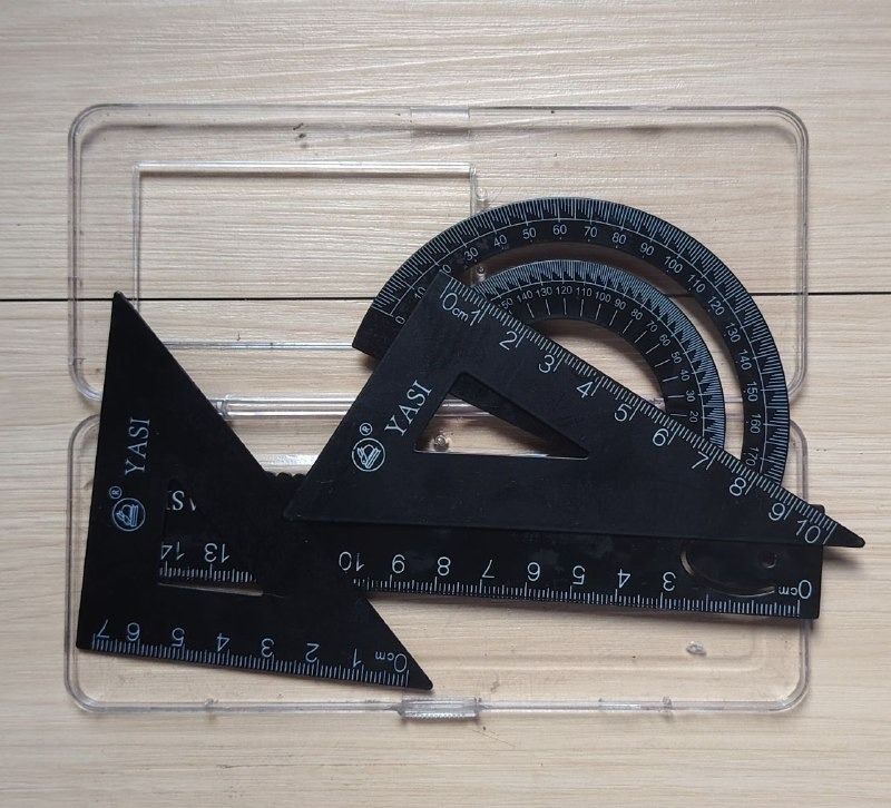 YASI Black Plastic Geometry Set Ruler Protractor (Category: Stationery & School Supplies) located in San Mateo. Submitted by carl_240 (Listing ID 1469195559, Image 1). Description: - Brand: YASI - Set includes: 15cm straight ruler, 2 triangular rulers, 180-degree protractor, and a storage case - Features: Clear white markings on every piece for easy reading - Perfect for: School, drafting, and technical drawing projects - Packaging: Flat, compact