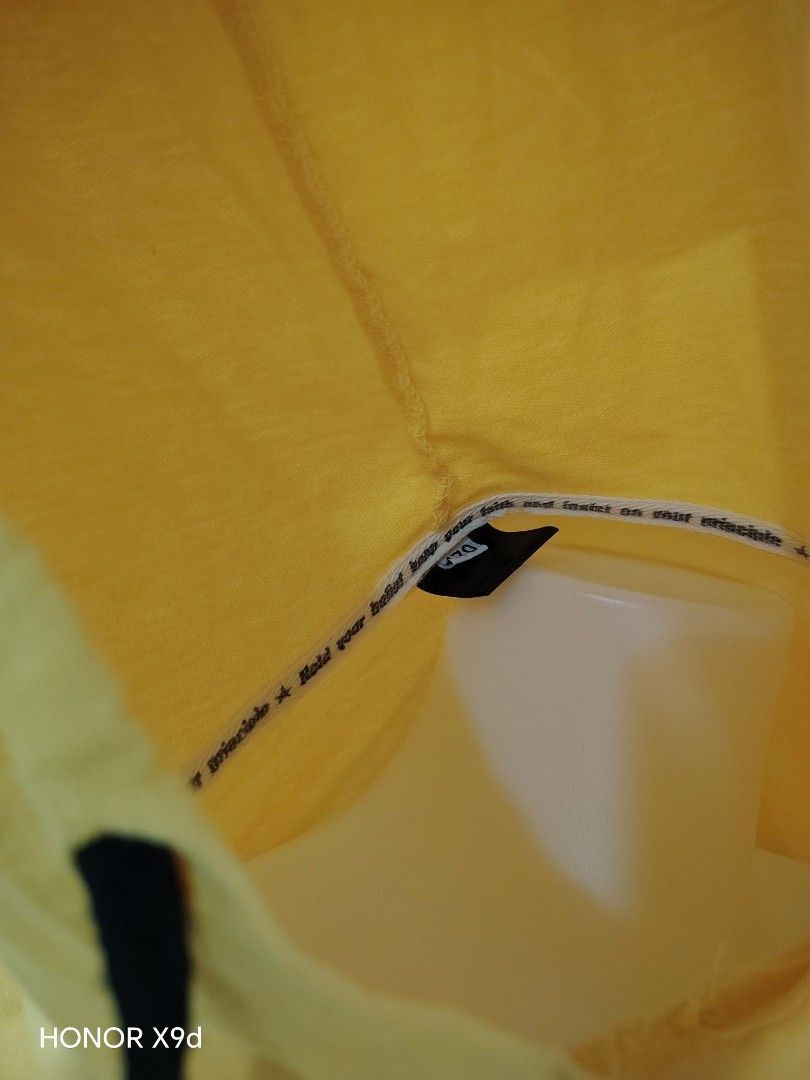 Yellow Crop Hoodie (Category: Coats, Jackets and Outerwear) located in Mabalacat. Submitted by Jackikay.PreLoved (Listing ID 1469296445, Image 3). Description: - Color: Bright yellow with black drawstrings - Design: 'DREAMIN' text printed across the front - Fit: Super short crop jacket ( long sleeves and ribbed cuffs ) - Material: Lightweight fabric, ideal for layering over tanks or bralettes - Size: 170 (fits like a standard women's cropped fit)