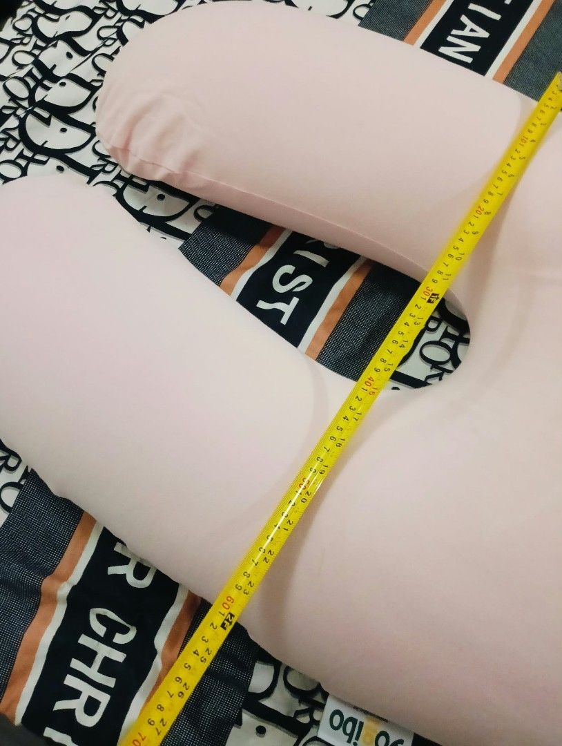 Yogibo Support Pink U-Shaped Pillow (Category: Breastfeeding & Bottle Feeding) located in Manila. Submitted by annetteasi22390 (Listing ID 1469173996, Image 2). Description: - Authentic Yogibo Support pillow in pink - Ideal for lounging, nursing, or pregnancy support - Measures approximately 90 cm long - Removable and washable cover with a secure zipper closure - Excellent, clean condition with zero stains or marks - Tag attached near the bottom 