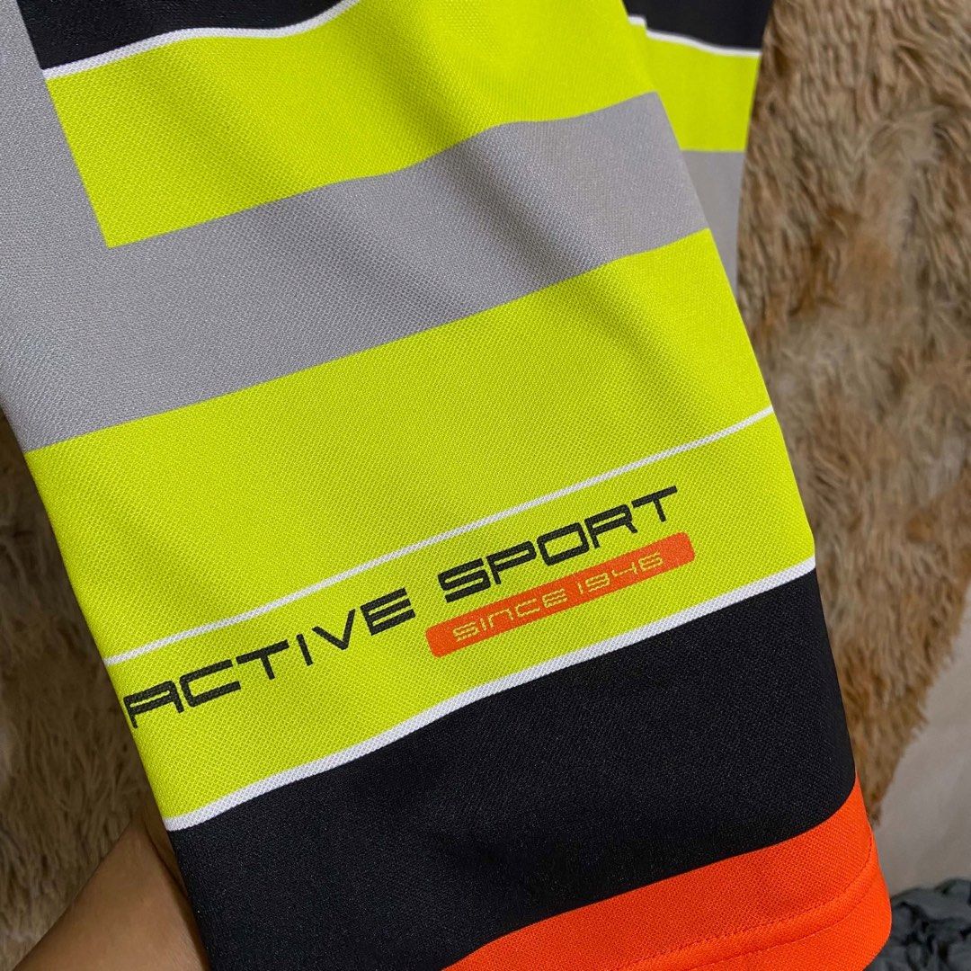 YONEX ACTIVE SLEEVELESS POLO SHIRT (Category: Activewear) located in Butuan. Submitted by jc13thrifts (Listing ID 1469306664, Image 3). Description: - Brand: YONEX - Style: Active Sleeveless Polo Shirt - Size: 95 - Color: Black with orange, neon yellow, and grey accents - Features: Collared neck with button placket, embroidered Yonex logo, 'ACTIVE SPORT' graphic print - Condition: Excellent pre-loved condition, lightweight and breathable fabric -