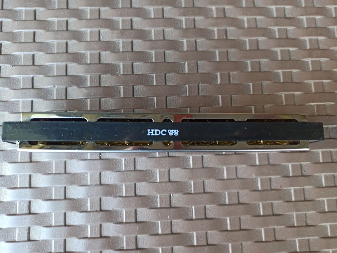 Young Chang HDC Harmonica Silver Tone - Good conditio without case (Category: Musical Instruments) located in Caloocan City. Submitted by rtarellano (Listing ID 1469287742, Image 2). Description: - Brand: Young Chang (HDC engraved) - Finish: Silver tone - Size: Approx. 6 inches long - Type: Standard tremolo/chromatic style with multiple sound holes - Condition: Clean exterior casing, ready for playing or collecting - Ideal for: Music practice and