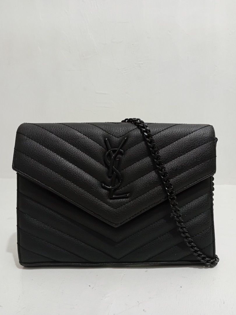 YSL Quilted Wallet on chain (Category: Luxury Bags & Wallets) located in Navotas City. Submitted by ms.soulana (Listing ID 1469201091, Image 1). Description: PreOwned lightly Used Saint Laurent Quilted Wallet on Chain black Small Compact Sized - Design: Black quilted leather with chic chevron pattern - Hardware: Monochrome black YSL monogram and chain strap - Closure: Flap with magnetic snap button - Interior: Card slots, slip pockets, and a zipp