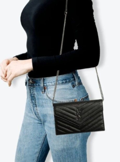 YSL Quilted Wallet on chain (Category: Luxury Bags & Wallets) located in Navotas City. Submitted by ms.soulana (Listing ID 1469201091, Image 2). Description: PreOwned lightly Used Saint Laurent Quilted Wallet on Chain black Small Compact Sized - Design: Black quilted leather with chic chevron pattern - Hardware: Monochrome black YSL monogram and chain strap - Closure: Flap with magnetic snap button - Interior: Card slots, slip pockets, and a zipp