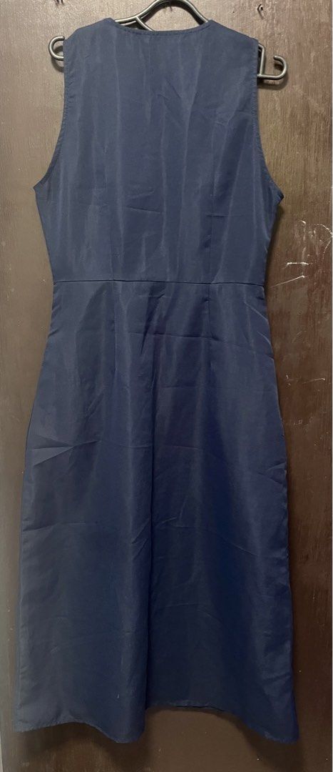 Zanzea Navy Blue Button-Front Sleeveless (Category: Dresses) located in Caloocan City. Submitted by iamqwertyy (Listing ID 1469253280, Image 2). Description: - Brand: Zanzea - Color: Navy blue - Size: S (tag attached) - Style: Sleeveless V-neck midi dress with a fitted waist, front button row, and side zipper - Condition: Clean and ready to wear, with a minor repaired snag near the pocket area (highlighted in the last two photos).