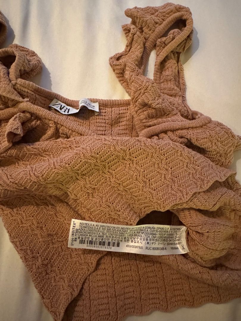 Zara Beige Brown Knit Ruffle Top (Category: Sleeveless) located in Cebu City. Submitted by txproj27 (Listing ID 1469213154, Image 3). Description: - Brand: Zara - Style: Knit tank top with textured pattern - Color: Beige Brown - Details: Square neckline with front ruffle trim, thick ruffle straps, scalloped hem - Condition/Use: Great basic for warm weather or layering - Care: Check tags for care instructions.