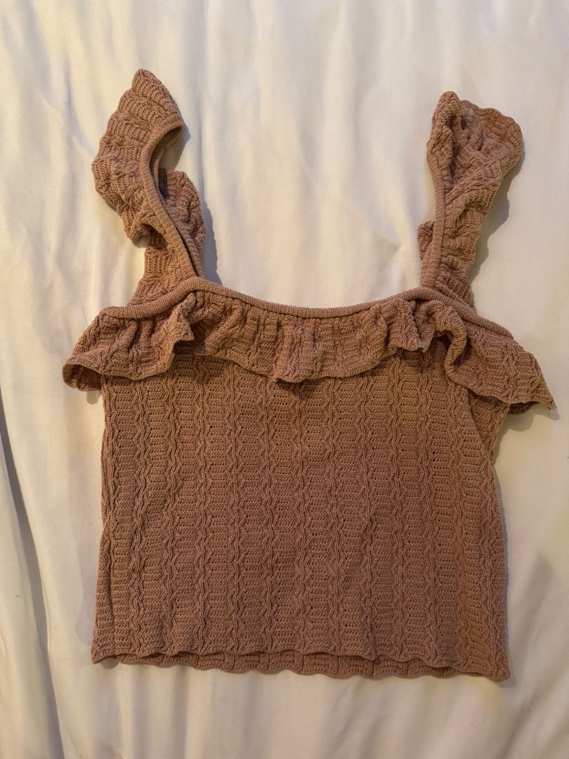 Zara Beige Brown Knit Ruffle Top (Category: Sleeveless) located in Cebu City. Submitted by txproj27 (Listing ID 1469213154, Image 1). Description: - Brand: Zara - Style: Knit tank top with textured pattern - Color: Beige Brown - Details: Square neckline with front ruffle trim, thick ruffle straps, scalloped hem - Condition/Use: Great basic for warm weather or layering - Care: Check tags for care instructions.