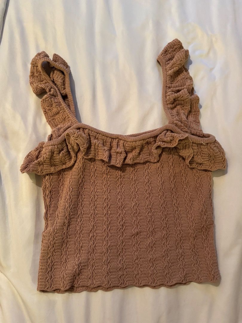 Zara Beige Brown Knit Ruffle Top (Category: Sleeveless) located in Cebu City. Submitted by txproj27 (Listing ID 1469213154, Image 2). Description: - Brand: Zara - Style: Knit tank top with textured pattern - Color: Beige Brown - Details: Square neckline with front ruffle trim, thick ruffle straps, scalloped hem - Condition/Use: Great basic for warm weather or layering - Care: Check tags for care instructions.