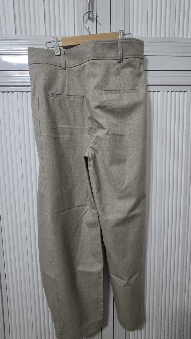 Zara Beige Trousers Size M (Category: Jeans) located in Cabanatuan. Submitted by belle_1013 (Listing ID 1469313027, Image 3). Description: - Brand: Zara - Size: M - Color: Beige - Origin: Made in Morocco - Style: Classic tailored cut with front pleats and button waist closure - Features: Functional pockets, clean condition inside and out - Versatility: Ideal for office wear and smart casual outfits.