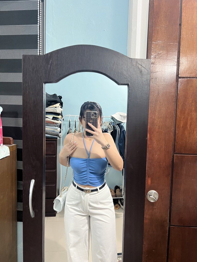 Zara Blue Halter Neck Ruched Crop Top (Category: Sleeveless) located in Angeles City. Submitted by camieday24 (Listing ID 1469355228, Image 2). Description: - Brand: Zara - Style: Bright blue halter crop top with thin tie-back straps - Details: Flattering ruched center front with a textured look - Material: Stretchy ribbed knit fabric for a comfortable fit - Condition: Worn once for a quick mirror selfie, super clean and practically new.