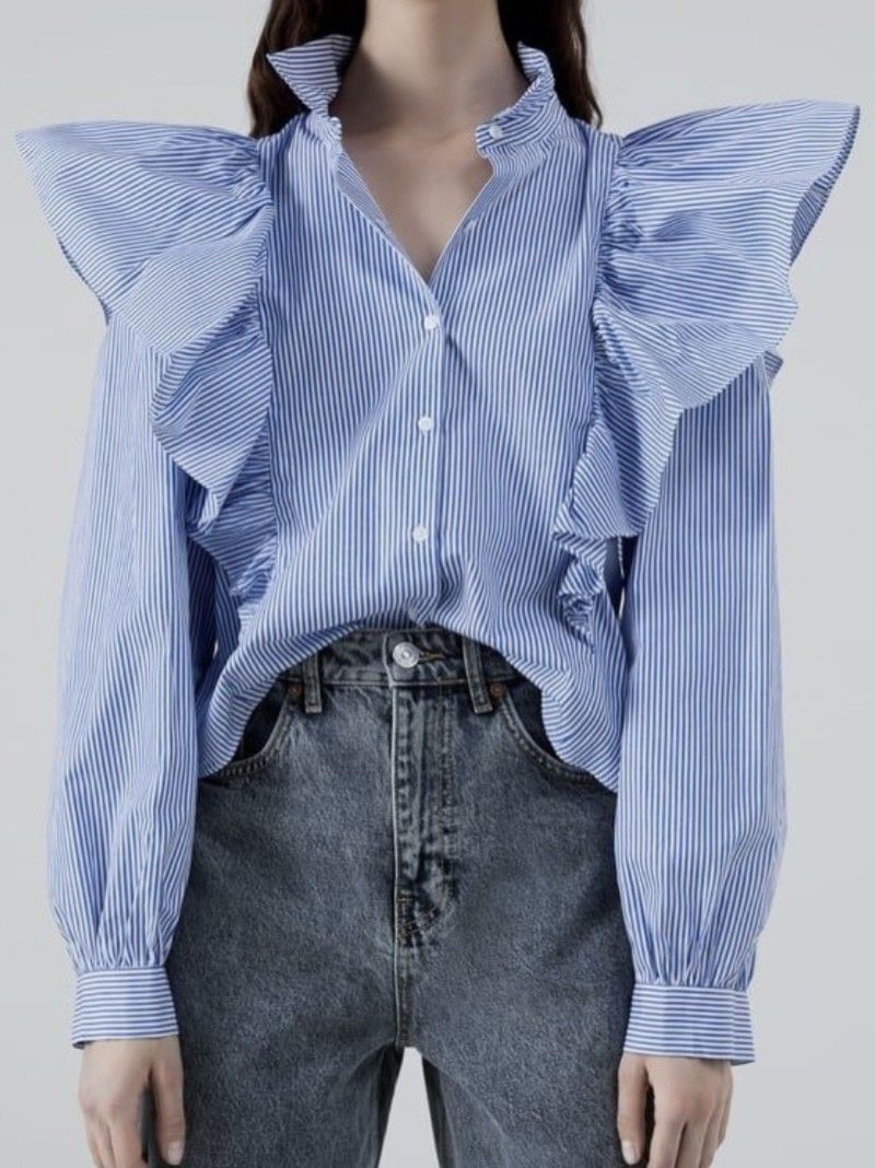 ZARA Blue White Striped Ruffled Blouse (Category: Blouses) located in General Santos City (Dadiangas). Submitted by amzonshop (Listing ID 1469241511, Image 3). Description: - Color/Pattern: Blue and white vertical stripes - Design: Dramatic oversized ruffled shoulders and matching front placket ruffles - Fit: Cropped length, ideal for high-waisted denim - Details: Classic pointed collar and buttoned cuffs - Material: Lightweight cotton blend with