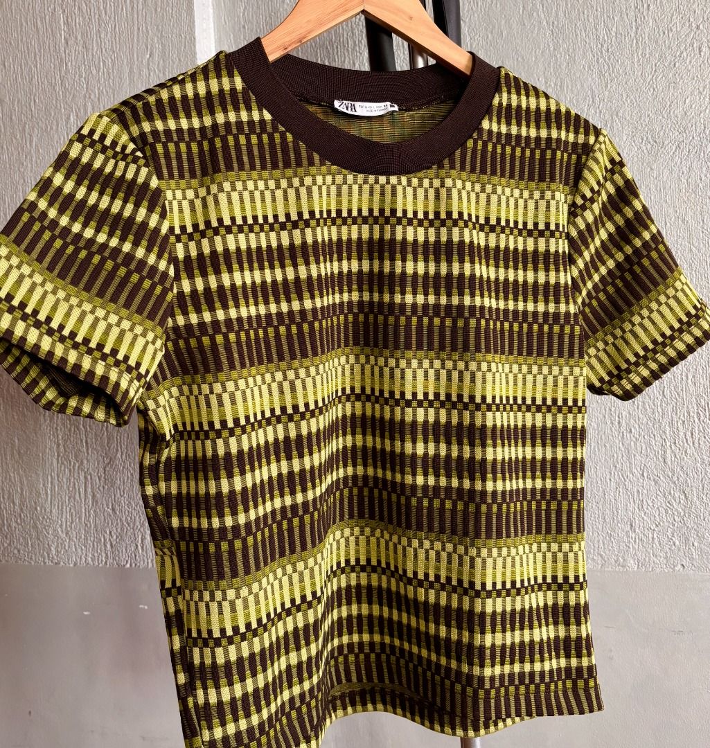 Zara Green Patterned T-Shirt Size L (Category: Shirts) located in Las Pinas. Submitted by tienda_ (Listing ID 1469188941, Image 1). Description: Brand: Zara Pattern in lime green, olive, and brown with solid dark brown crew neck Size: EUR L, USA L, MEX 30 (Regular fit) Material: Cotton blend with textured weave Origin: Made in Turkey .