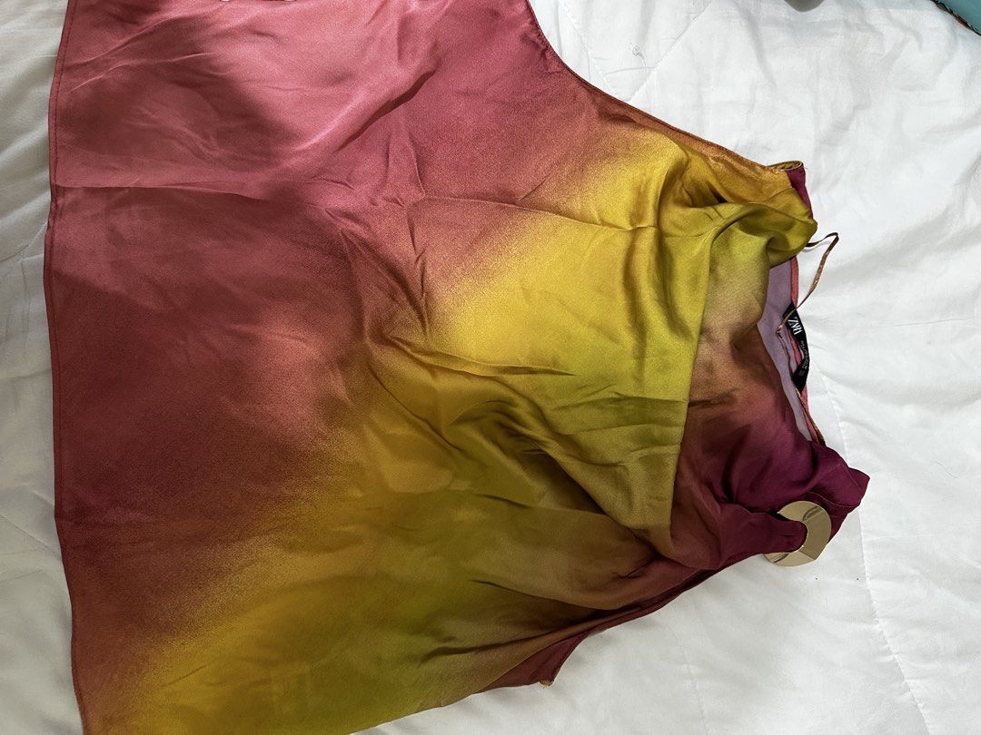 Zara Ombre Gradient Satin Top Size L (Category: Blouses) located in Balanga. Submitted by jamilbeauty5 (Listing ID 1469245689, Image 2). Description: - Brand: Zara - Style: Ombre satin top with vibrant pink, yellow, and burgundy gradients - Size: EUR L / USA L / MEX 30 - Origin: Made in Morocco - Material: Silky fabric with a smooth, luxurious finish - Versatile: Easy to dress up for a night out or keep casual for everyday wear.