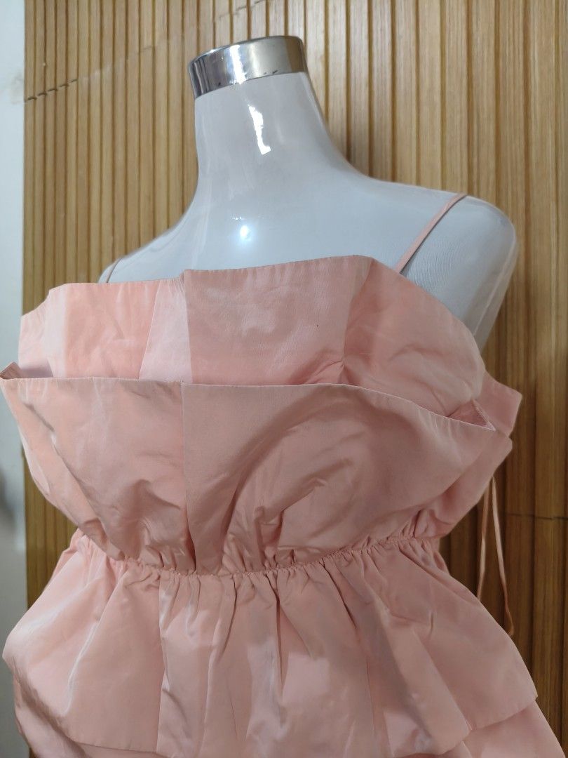 ZARA Pink Strapless Ruffle Top Size XL (Category: Sleeveless) located in Taguig. Submitted by ashie_clothing (Listing ID 1469205206, Image 2). Description: - Brand: Zara - Color: Pink - Size: XL - Condition: Brand new with original tags (never worn) - Design: Strapless neckline with delicate spaghetti straps - Details: Gathered ruffle accents throughout and voluminous layered bubble hem.
