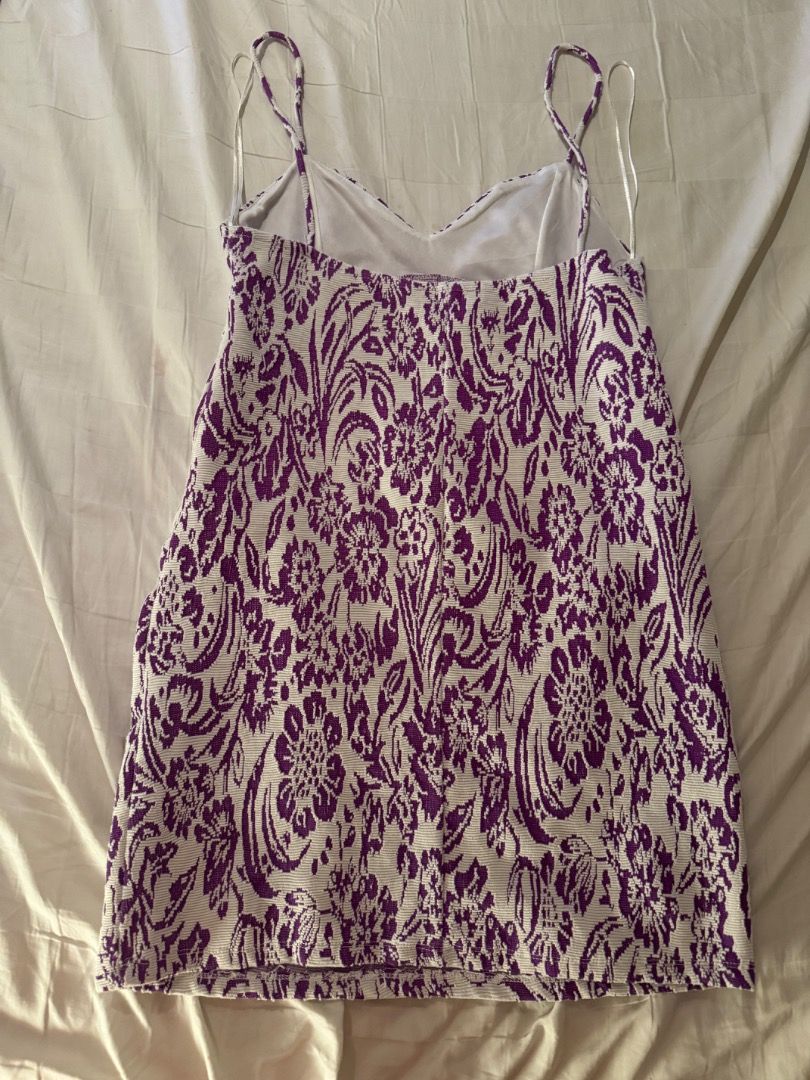 Zara Purple and White Patterned Mini Dress Small (Category: Dresses) located in Cebu City. Submitted by txproj27 (Listing ID 1469215417, Image 2). Description: Zara patterned in purple and white. Size S, EUR S, USA S, MEX 26. Made in Morocco. Textured knit material with a bold graphic pattern throughout. Sleeveless style with white trim along the neckline and straps. Clean labels attached inside..