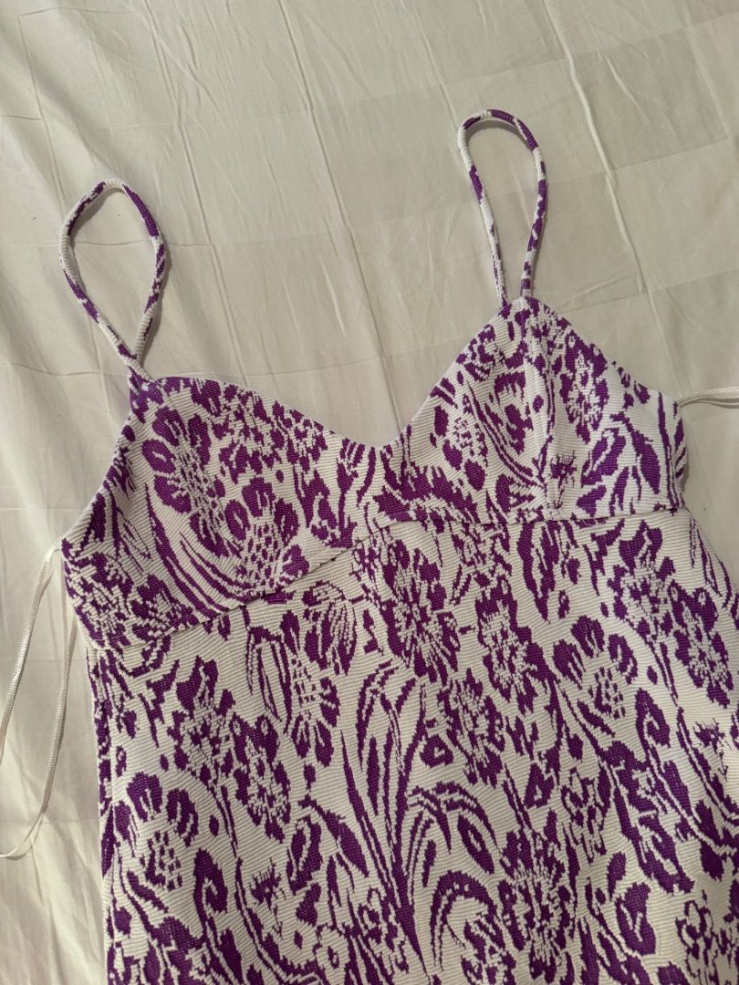 Zara Purple and White Patterned Mini Dress Small (Category: Dresses) located in Cebu City. Submitted by txproj27 (Listing ID 1469215417, Image 3). Description: Zara patterned in purple and white. Size S, EUR S, USA S, MEX 26. Made in Morocco. Textured knit material with a bold graphic pattern throughout. Sleeveless style with white trim along the neckline and straps. Clean labels attached inside..