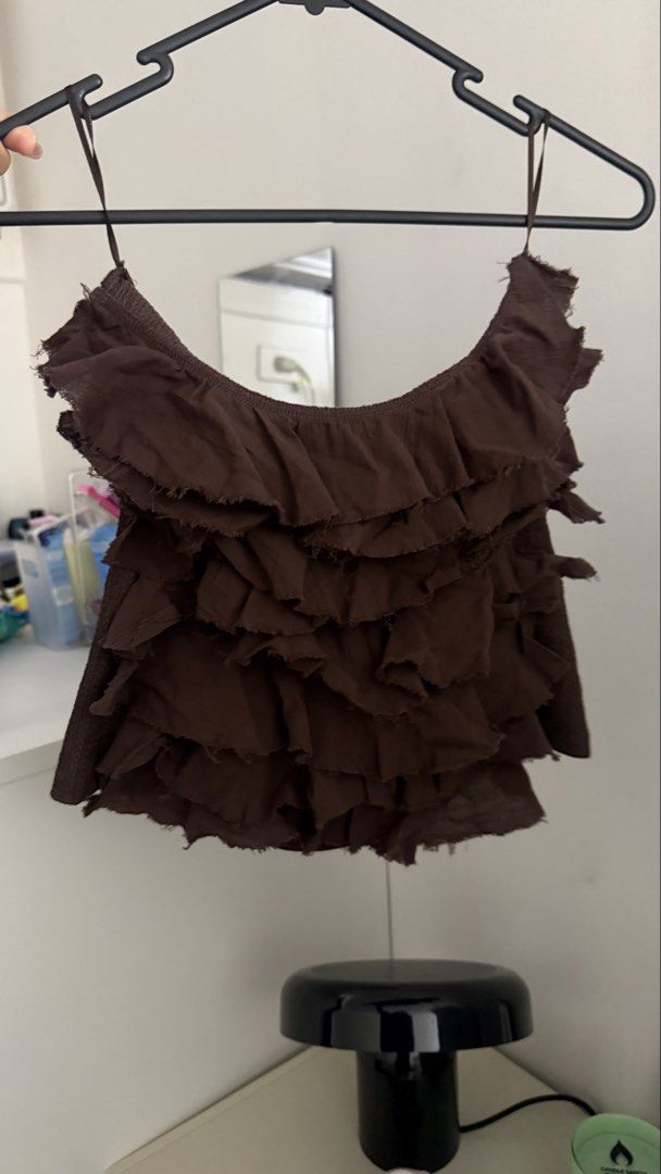 Zara Strapless Top with Ruffles (Category: Sleeveless) located in Makati City. Submitted by andrae.thomas (Listing ID 1469257912, Image 3). Description: - Brand: Zara - Style: Strapless top with all-over raw-edge ruffles - Color: Rich brown - Material: Textured knit fabric with stretch - Size: EUR/USA L (Made in Morocco) - No when worn photo - Used once - Original Zara bought online Makati area Meet up: CSB, DLSU, Taft.