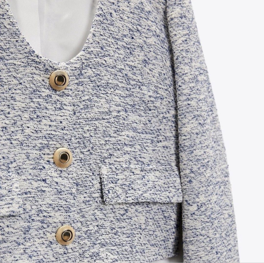 Zara Textured Crop Jacket Blue White Size S (Category: Coats, Jackets and Outerwear) located in Makati City. Submitted by lovedbyalexis_ (Listing ID 1469304016, Image 2). Description: - Brand: Zara - Style: Crop jacket in white and blue textured tweed - Details: Deep v-neckline, gold-tone metallic buttons, structured shoulders, faux pocket flaps - Interior: Fully lined - Size: EUR S / USA S / MEX 26 - Origin: Made in Turkey.