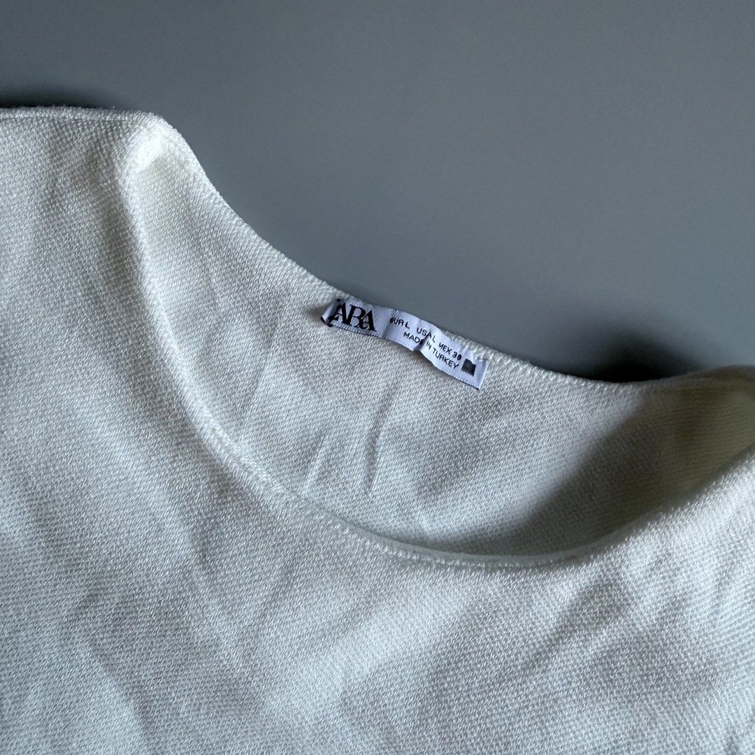 Zara White Knit Tank Top Size L (Category: Sleeveless) located in Benito Soliven. Submitted by markedasdifferent (Listing ID 1469252562, Image 2). Description: - Brand: Zara (Inditex Group) - Color: White - Size: L (fits standard) - Style: Knitted tank top, round neckline, sleeveless - Origin: Made in Turkey -19/28.5 - Condition: Clean, excellent pre-loved condition - Perfect everyday basic piece.