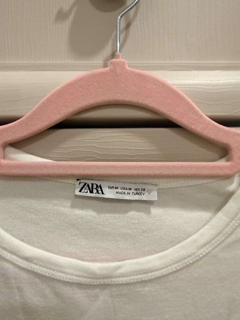 Zara White Ribbed Crop Top Size M (Category: Shirts) located in Mandaluyong City. Submitted by riz_040521 (Listing ID 1469334441, Image 2). Description: - Brand: Zara - Size: Medium (true to size) - Color: White - Material/Origin: Made in Turkey - Design: Ribbed texture, short sleeves, round neckline - Style tip: Perfect basic piece to pair with high-waisted jeans or skirts.