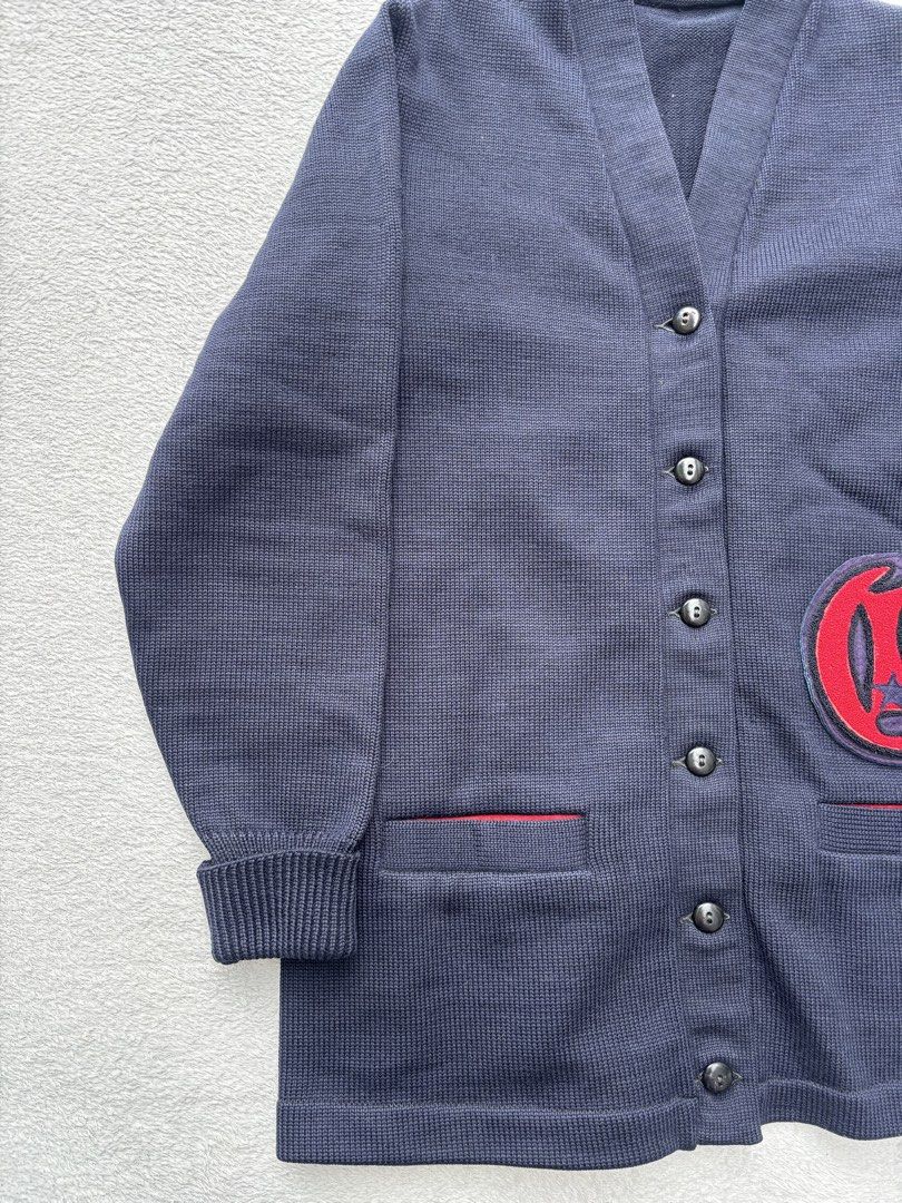 1950s Varsity Wool Letterman Cardigan (Category: Coats, Jackets and Outerwear) located in Baguio. Submitted by thecollector2600 (Listing ID 1469436463, Image 3). Description: Signs of usage This mid-century varsity letterman cardigan exemplifies traditional American collegiate knitwear from the 1950s to early 1960s. Constructed from a dense, heavy-gauge navy wool, the piece features deep front welt pockets lined in contrasting red rayon fabric an