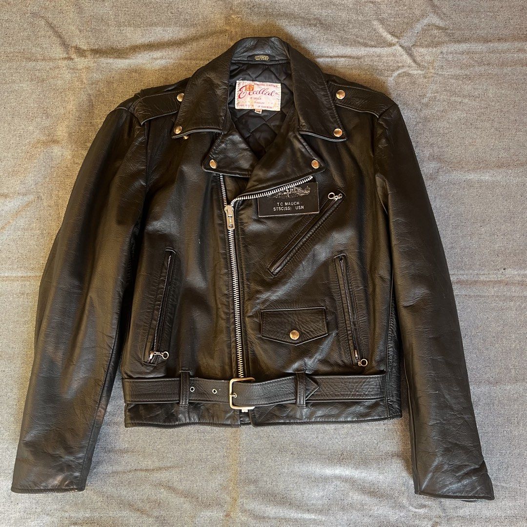1980s Excelled Cowhide Leather Biker Jacket (Category: Coats, Jackets and Outerwear) located in Manila. Submitted by minsanseller_madalasbuyer (Listing ID 1469428255, Image 1). Description: (Size 38 on tag) Chest - 21.5” Length - 24.5” Shoulder - 17.5” Sleeve - 24.5” - Heavy cowhide leather, quilted lining. - Personalized US Navy leather patch by previous owner. - Ideal main zipper, YKK sleeve zippers. - All hardware works. - Needs leather condit