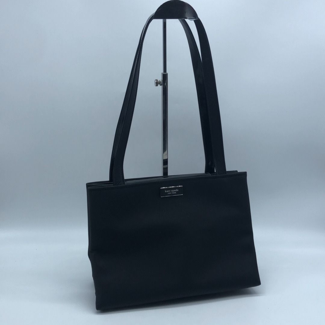 267010424 KATE SPADE BAG NYLON HAND BAG (Category: Luxury Bags & Wallets) located in Taguig. Submitted by ecoring.ph (Listing ID 1469415541, Image 1). Description: ◆CONDITION: B ◆DESCRIPTIONS: (Other defects/info:) OUTER: The body of the bag is stained and dirty, and shows signs of use. The bottom and bottom corners of the bag are stained, dirty, and wrinkled, and show signs of use. The patent leather on the top handle, flap, and inner leather to