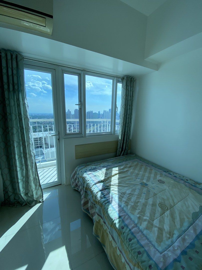 2BR SM Light for Rent (Category: Apartments & Condos) located in Quezon City. Submitted by baroqueboy (Listing ID 1469426014, Image 3). Description: - Semi-furnished condo unit w/ balcony -(one each) sofa bed, bed frame & mattress, 2 heaters -(rare) very spacious as one kitchen has been deleted - Bedroom comes with a double bed and direct balcony access -High floor with stunning views of the BGC and Makati skyline Excluding assoc dues PARKING AVA