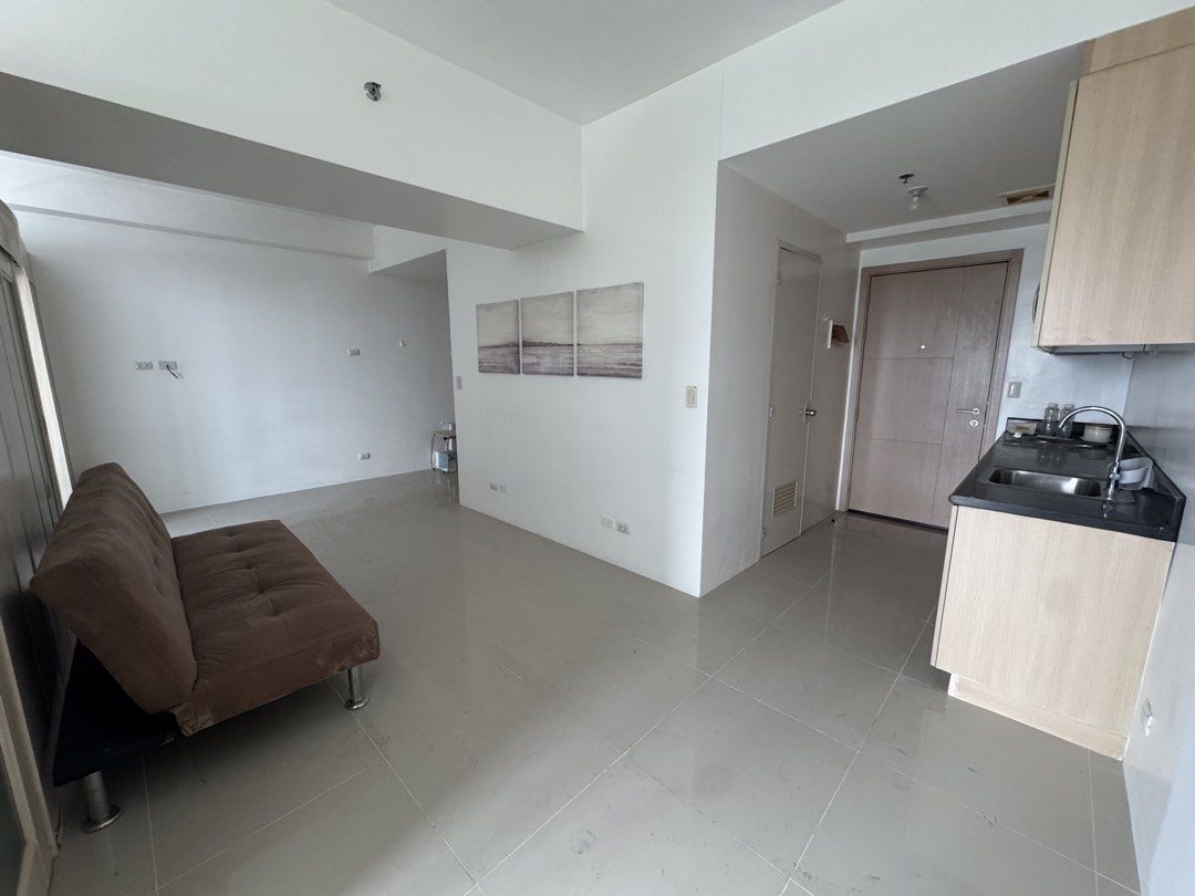 2BR SM Light for Rent (Category: Apartments & Condos) located in Quezon City. Submitted by baroqueboy (Listing ID 1469426014, Image 2). Description: - Semi-furnished condo unit w/ balcony -(one each) sofa bed, bed frame & mattress, 2 heaters -(rare) very spacious as one kitchen has been deleted - Bedroom comes with a double bed and direct balcony access -High floor with stunning views of the BGC and Makati skyline Excluding assoc dues PARKING AVA